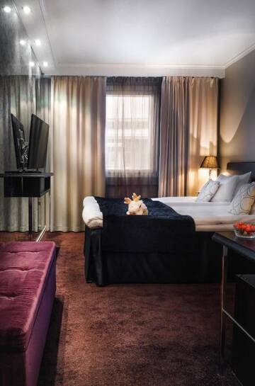 Фото номера Двухместный номер с 2 отдельными кроватями Отель Arctic City Hotel г. Рованиеми 3
