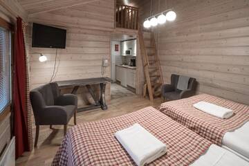 Фото номера Стандартное шале (для 4 человек) с сауной Отель Lapland Hotels Ounasvaara Chalets г. Рованиеми 8