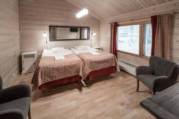 Фото номера Стандартное шале (для 4 человек) с сауной Отель Lapland Hotels Ounasvaara Chalets г. Рованиеми 2