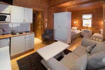 Фото номера Улучшенное шале (для 5 человек) с сауной Отель Lapland Hotels Ounasvaara Chalets г. Рованиеми 5
